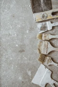 Plastering tools on cement background. Stock Photos