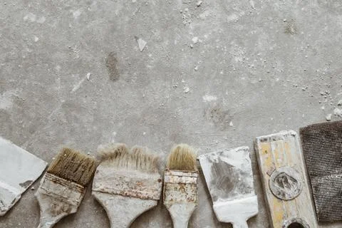 Plastering tools on cement background. Stock Photos