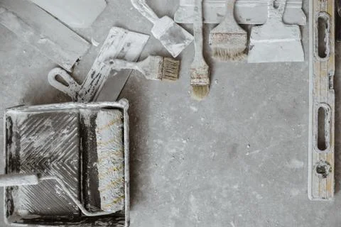 Plastering tools on cement background. Stock Photos