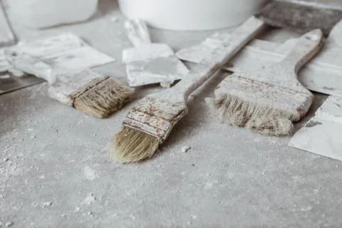 Plastering tools on cement background. Stock Photos