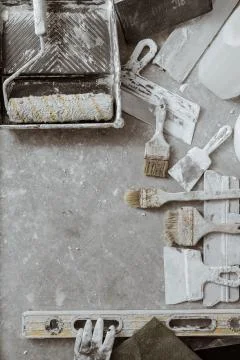 Plastering tools on cement background. Stock Photos