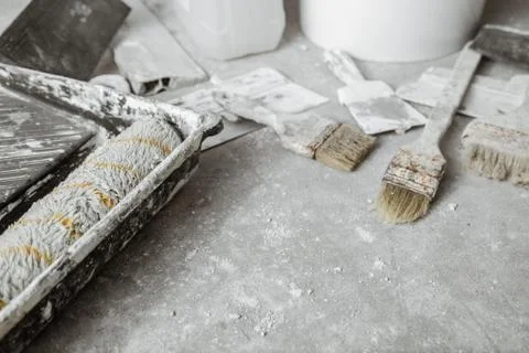 Plastering tools on cement background. Stock Photos