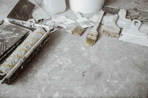 Plastering tools on cement background. Stock Photos