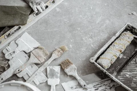 Plastering tools on cement background. Stock Photos