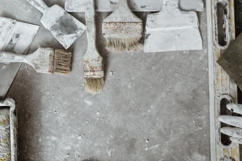 Plastering tools on cement background. Stock Photos