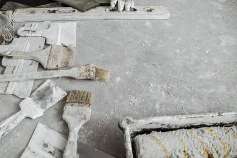 Plastering tools on cement background. Stock Photos