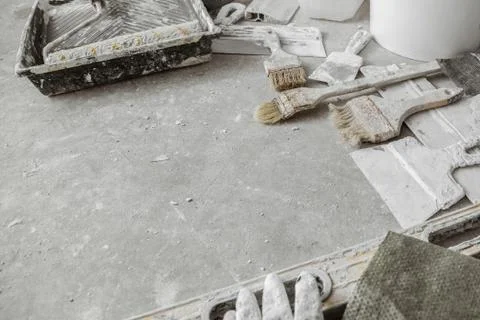 Plastering tools on cement background. Stock Photos