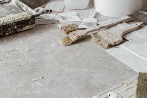 Plastering tools on cement background. Stock Photos