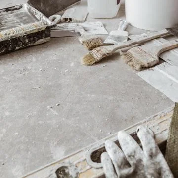 Plastering tools on cement background. Stock Photos