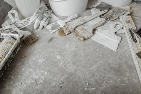 Plastering tools on cement background. Stock Photos