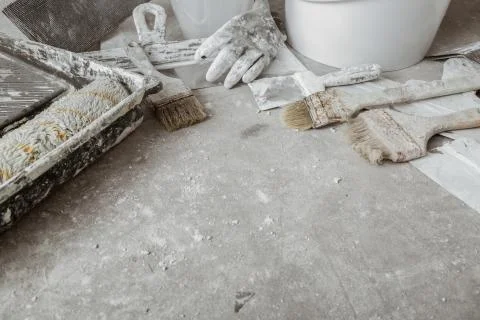 Plastering tools on cement background. Stock Photos