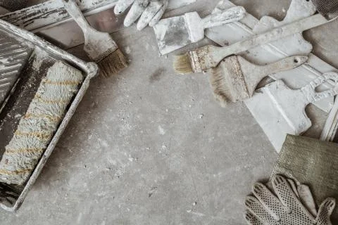 Plastering tools on cement background. Stock Photos