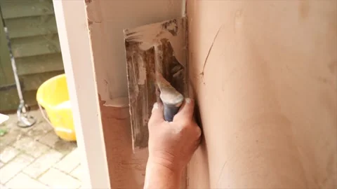 Plastering a wall Stock Footage 136258365