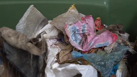Plastic and bottles in a trash bin. bags and cellophane. miscellaneous waste. Stock Footage 127046876
