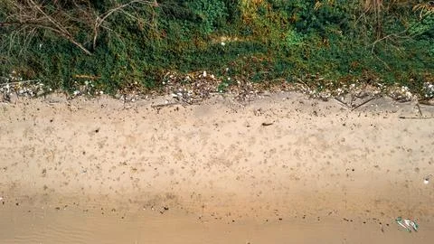 Plastic and garbage on a beach Stock Photos