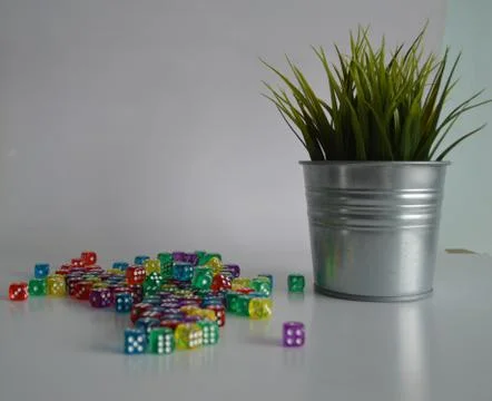 Plastic arcylic d6 six sided die dice with plant in bucket Stock Photos
