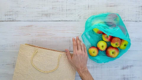 Plastic bag and paper bag and apples Stock Footage 141988005