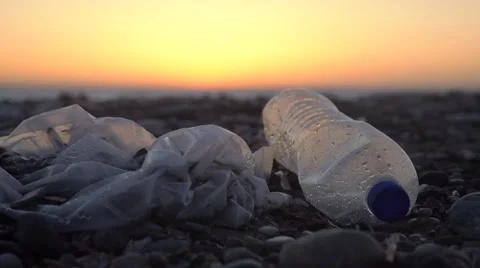 Plastic bag and plastic bottle at a beach Stock Footage 67585025