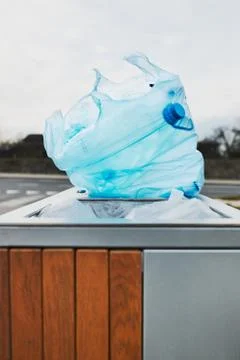 Plastic bag full of plastic waste put on outdoor trash Stock Photos