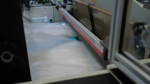 Plastic bag making cutting machine - production of packaging bags: close up Stock Footage 337061078