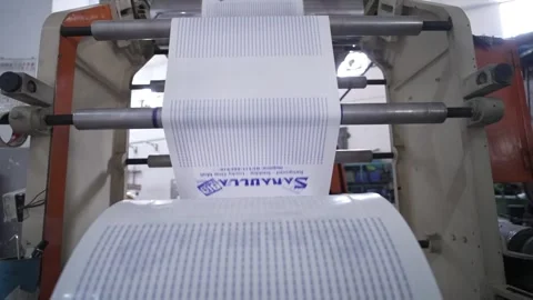 Plastic bag printing machine processing Sanula brand packaging in Karachi Stock Footage 301307699