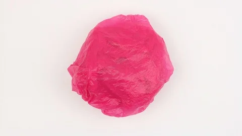 Plastic bag rotates on white background and change color, garbage eco problem Stock-Footage 105554624