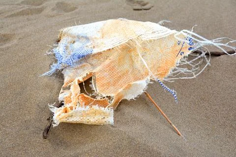A plastic bag washed up on the beach Stock-Fotos