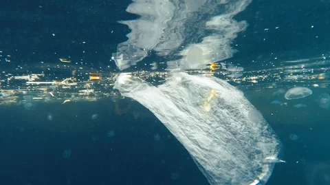 Plastic Bags And Other Garbage Floating Underwater Stock Footage