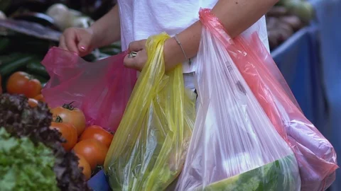 Plastic bags and tomatoes Stock Footage 112642203