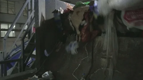 Plastic bags in sorting. Waste sorting. Conveyor for sorting. Recycling waste Stock Footage 70353518