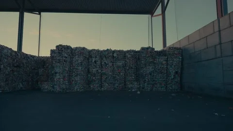 Plastic Bales Stacked Inside a Large Industrial Waste Sorting Facility Stock Footage 331166553