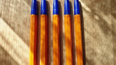 Plastic ball pens on the table in the close-up Stock Footage 109270389