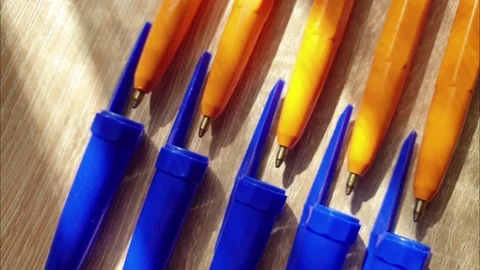 Plastic ball pens on the table in the close-up Stock Footage 109271909