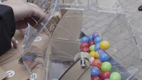 Plastic balls are mixed in a bingo drum. the drawing of prizes using a Lotto 库存影片 306145227
