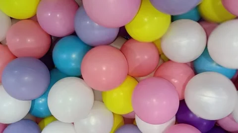 Plastic balls in a pit for play areas, ball pits, childrens entertainment, fun z Stock-Footage 335058196