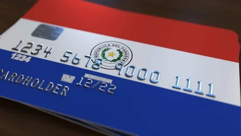 Plastic bank card featuring flag of Paraguay. Paraguayan national banking system Stock Footage 111978041