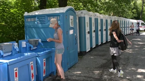 Plastic bio composting toilets standing in a row Stock Footage 66054783