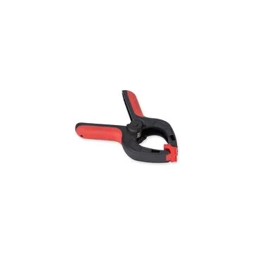 Plastic black and red spring clamp isolated over white background Stock Photos
