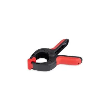 Plastic black and red spring clamp isolated over white background Stock Photos