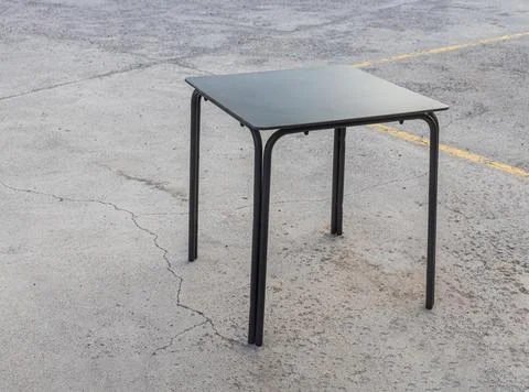 Plastic black table on the gray background Stock Photos