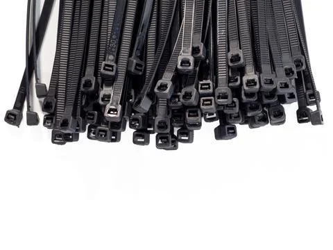 Plastic black ties on a white background. Stock Photos