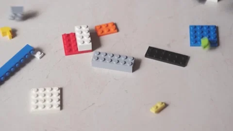 Plastic blocks of a children's designer fall to the floor. Stock Footage 248708055
