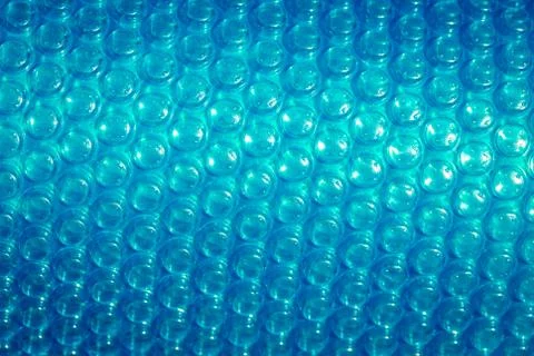 Plastic blue bubble wrap texture background, close up. Stock Photos