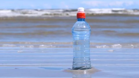 Plastic bottle on the background of the sea Stock Photos