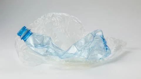 Plastic bottle, bag on a light background. The concept of ecology. Stock Photos