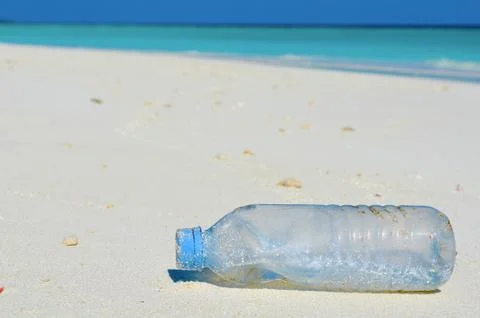 Plastic Bottle on the Beach Stock Photos