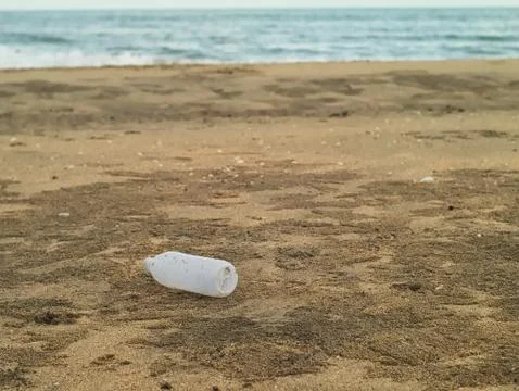 Plastic bottle on the beach 写真素材