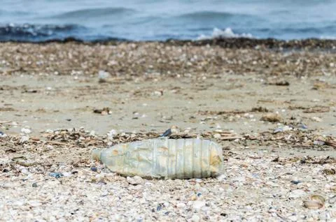 Plastic bottle on the beach Stock Photos