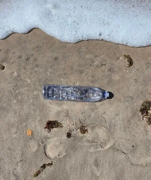 Plastic bottle on the beach Stock Photos