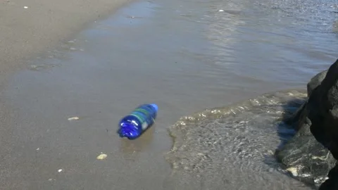 Plastic bottle beach pollution Stock Footage 136666353